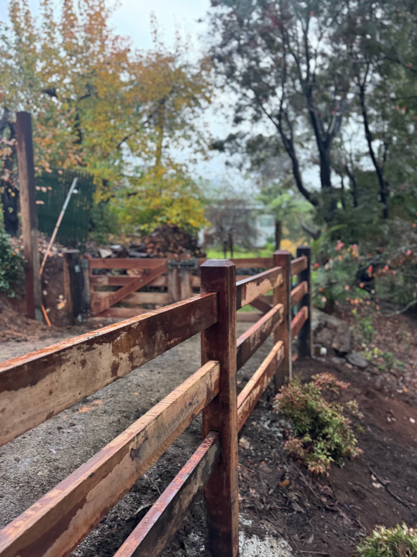 Rails mortised into a hardwood post on a garden fence